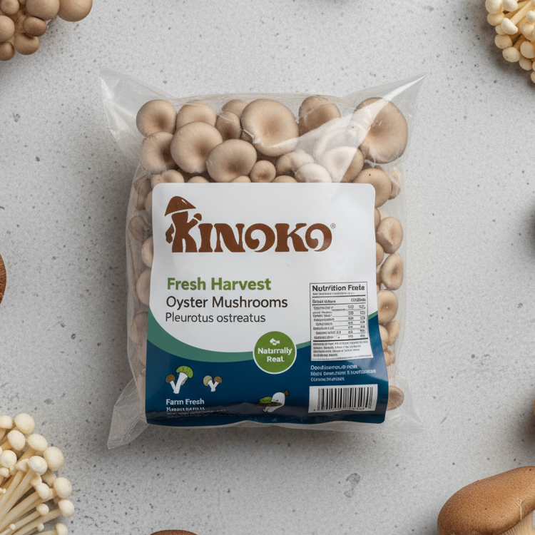 Clear plastic bag of Kinoko Fresh Harvest oyster mushrooms on a gray surface with other mushrooms around.