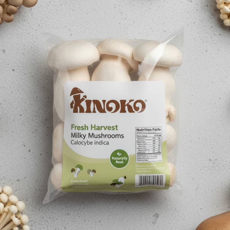 Package of Kinoko Fresh Harvest Milky Mushrooms (Calocybe indica) with nutrition facts on a gray surface surrounded by different mushrooms.